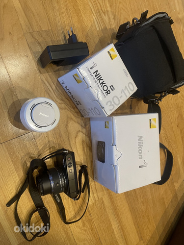 Беззеркальная камера Nikon S1 с двумя объективами Nikkor 11-27,5 мм F3.5 (фото #1)