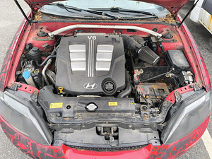 Hyundai Coupe, 2005 (7 foto / 8)