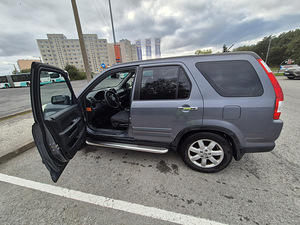 Honda CR-V 2006 a. (7 foto / 9)
