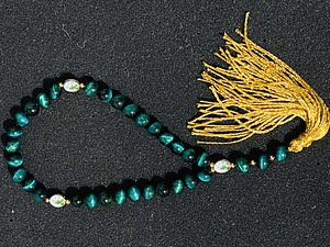 Müün kividest tehtud rosaariumi helmeid