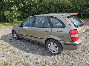Mazda 323f 1998 aasta (9 foto / 12)