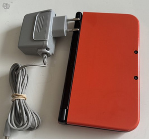 Новая Nintendo 3DS XL оранжево-черного цвета (2 фото из 3)