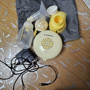 Medela(молокоотсос)